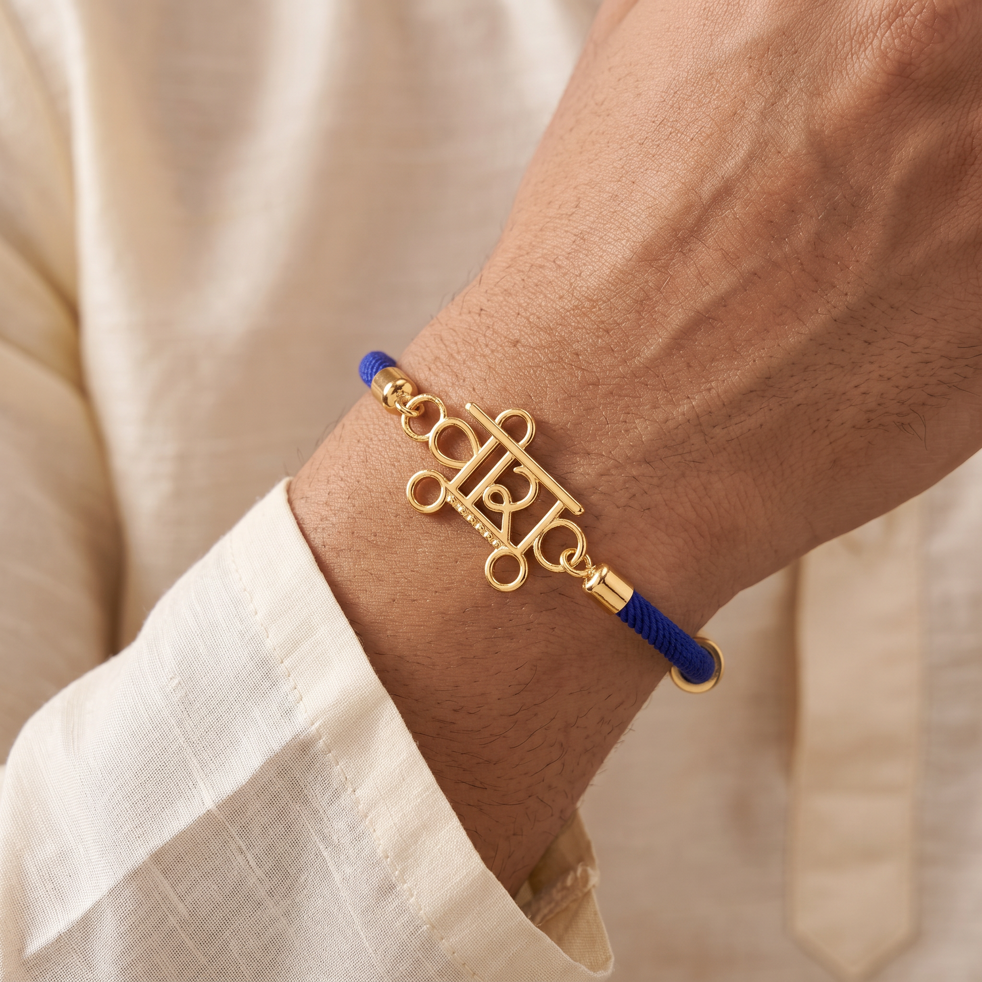 [finish: gold] Veera Charm Silver Rakhi 